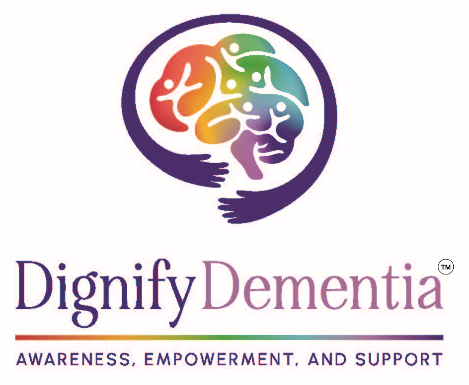 Colorful brain‑shaped logo made of diverse human faces held by two purple hands, with the words “Dignify Dementia — Awareness, Empowerment, and Support.”